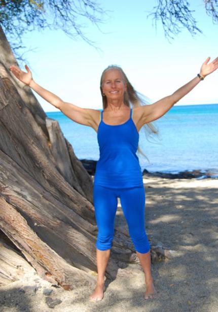 Yoga teacher, Calley O'Neill on the Big Island of Hawaii teaching seaside yoga at Lava Lava Beach Club, Waikoloa Beach Resor